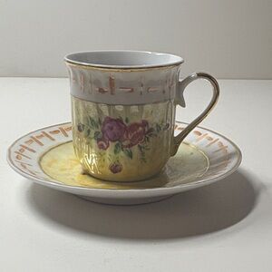 Gold and White Porcelain Cup and Saucer